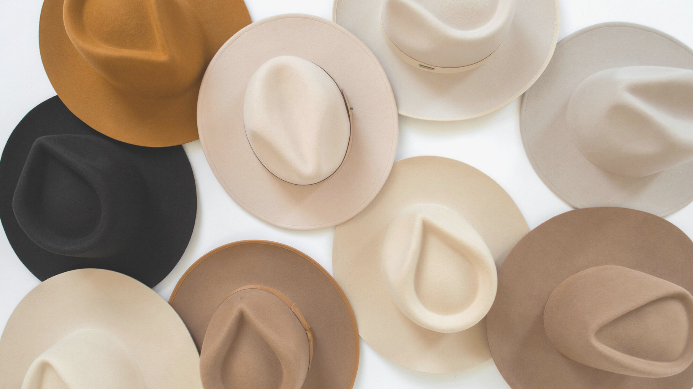 flat lay of felt fedora hats