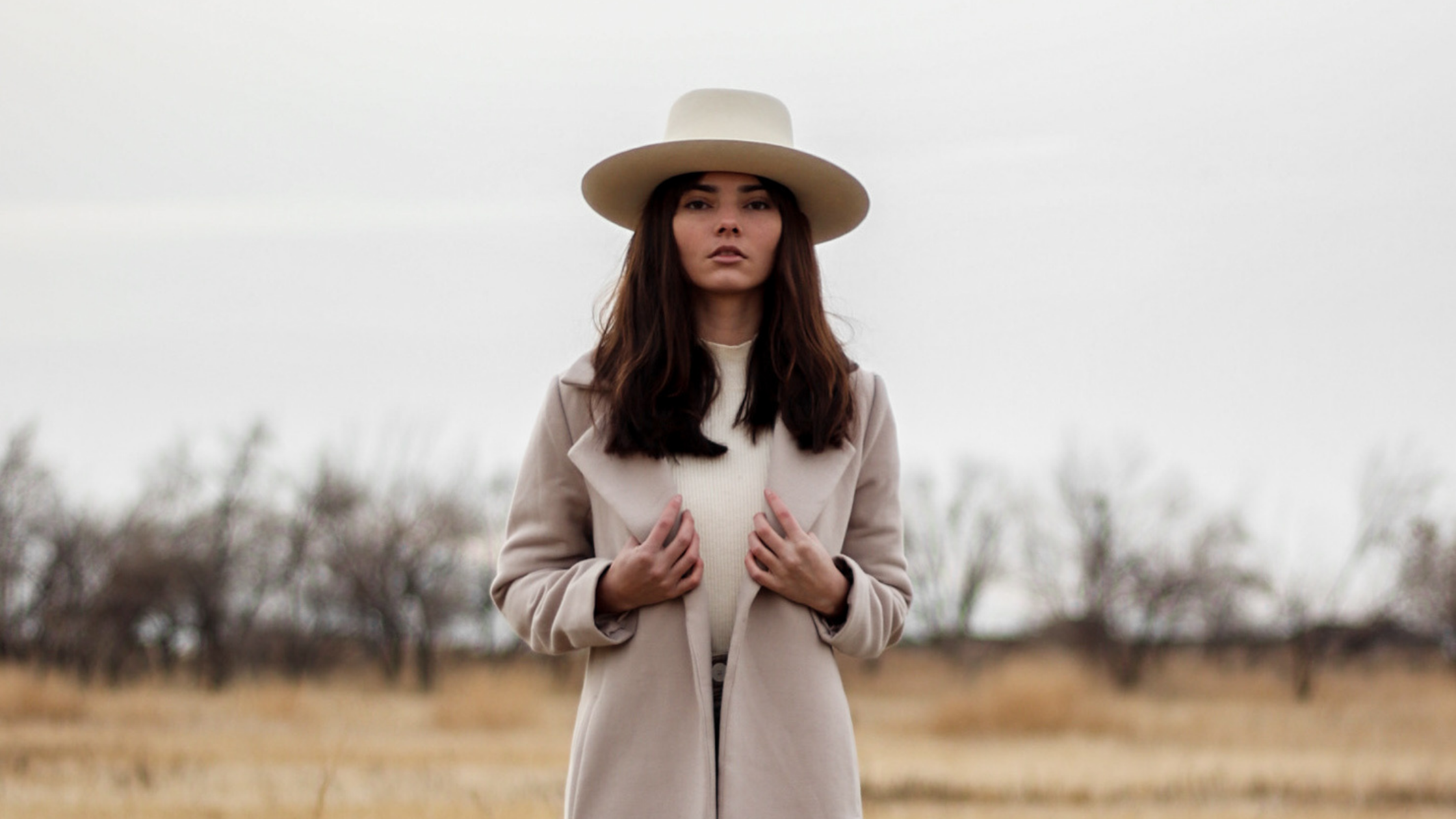 woman wearing fedora outdoors