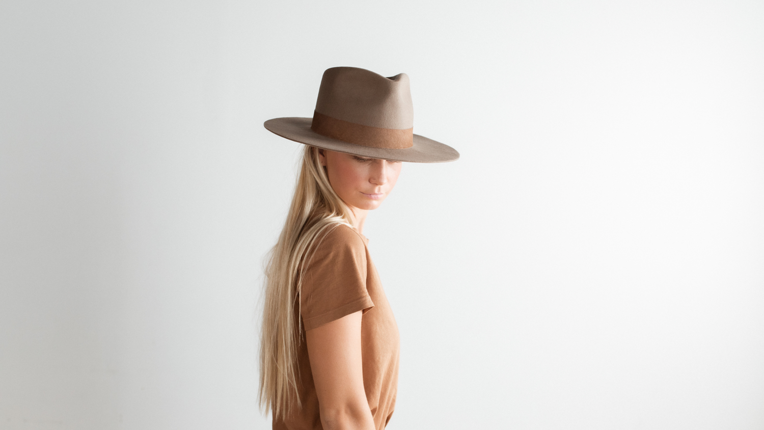 woman wearing fedora hat side profile