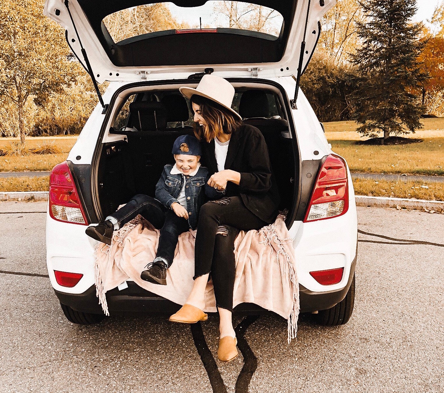 woman in car with son