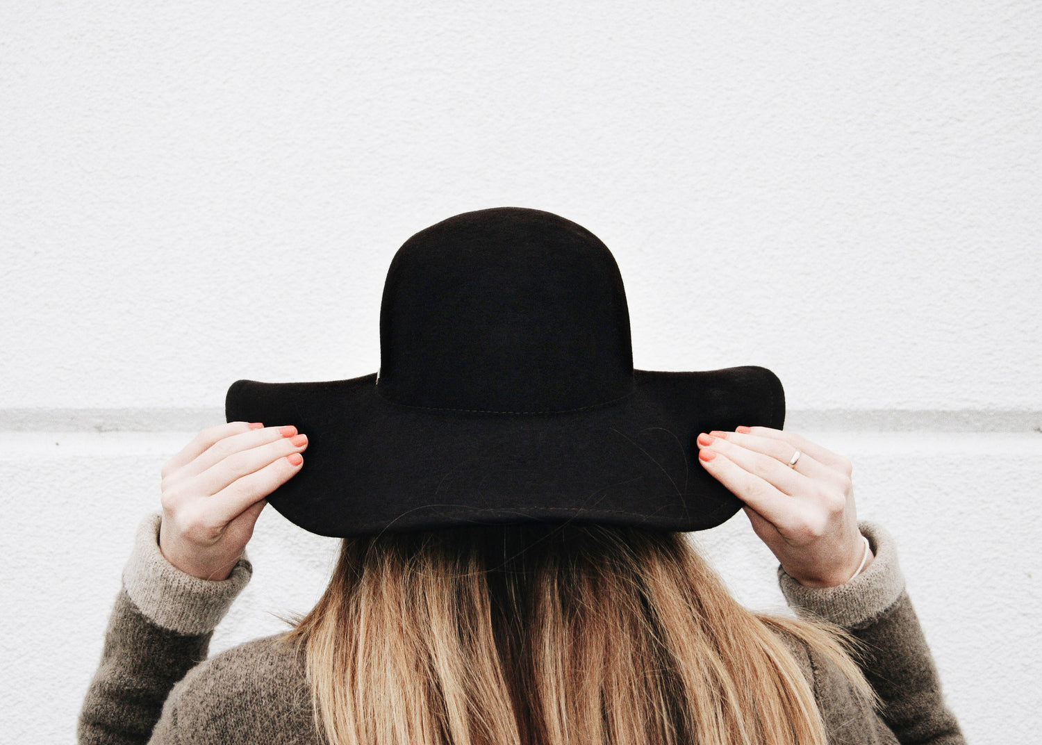 Hannah with a black felt hat