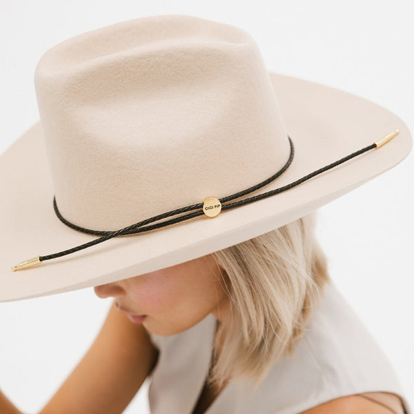 Gigi Pip hat bands + trims for women's hats - Thin Braided Wrap Band - thin braided leather adjustable hat band featuring a plated gold Gigi Pip circle logo and detailing [black]