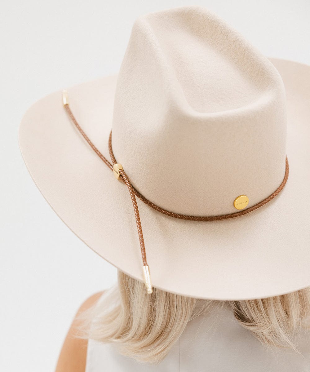 Gigi Pip hat bands + trims for women's hats - Thin Braided Wrap Band - thin braided leather adjustable hat band featuring a plated gold Gigi Pip circle logo and detailing [cognac]