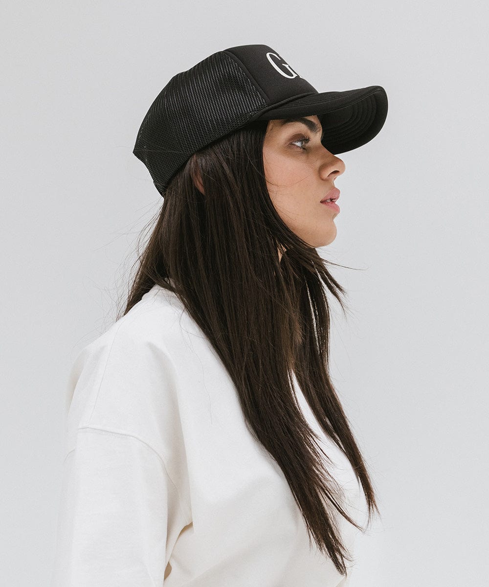 Gigi Pip trucker hats for women - Gigi Foam Trucker Hat - 100% polyester foam + mesh trucker hat with a curved brim featuring the word "Gigi" in a contrasting color as a design across the front panel [black]