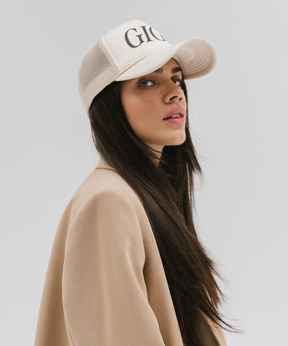 Gigi Pip trucker hats for women - Gigi Foam Trucker Hat - 100% polyester foam + mesh trucker hat with a curved brim featuring the word "Gigi" in a contrasting color as a design across the front panel [white]