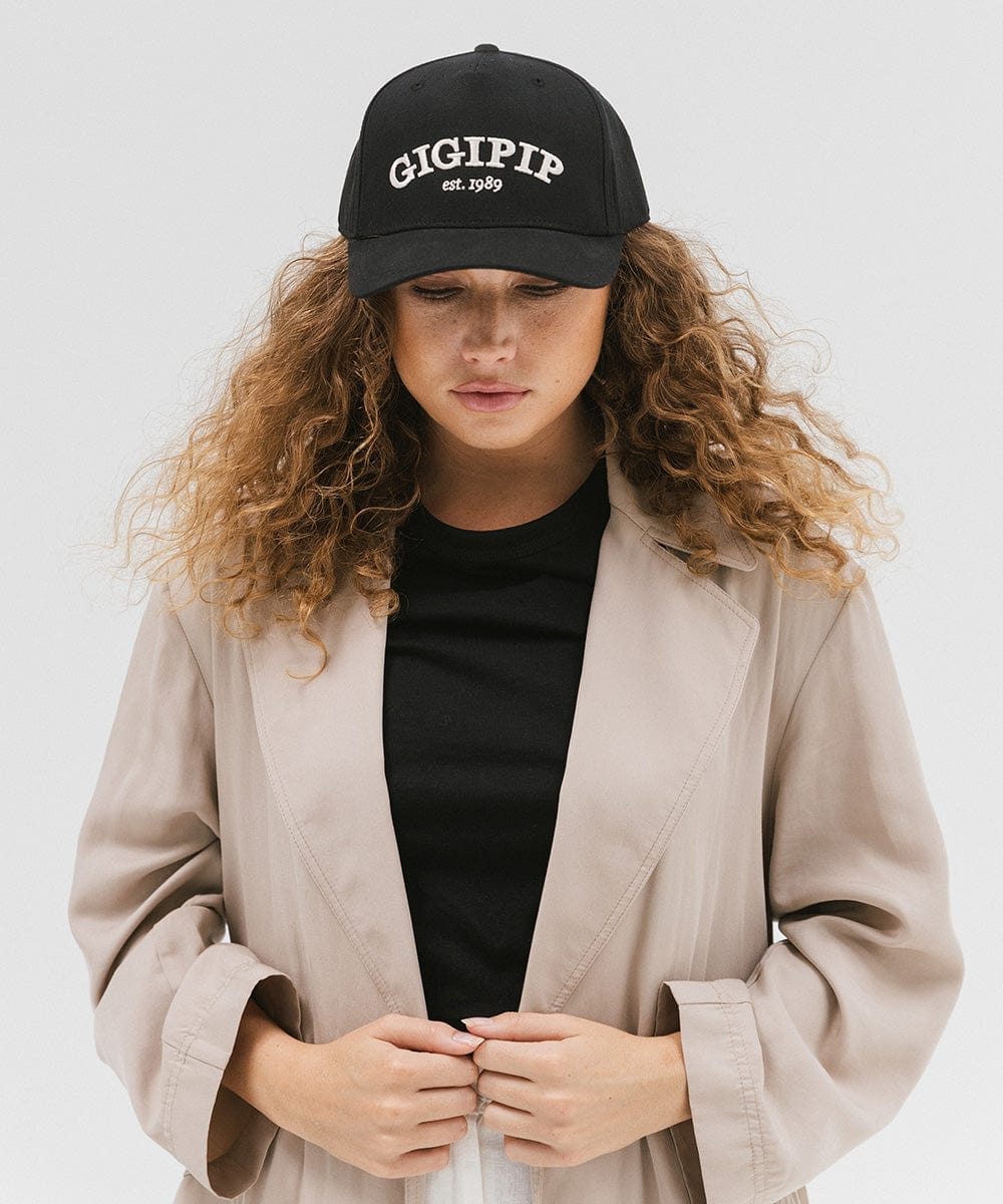 Gigi Pip trucker hats for women - Gigi Pip Canvas Trucker Hat - 100% Cotton Canvas w/ cotton sweatband + reinforced from panel with 100% polyester mesh trucker hats with gigi pip embroidered on the front panel with an adjustable velcro bag [black]