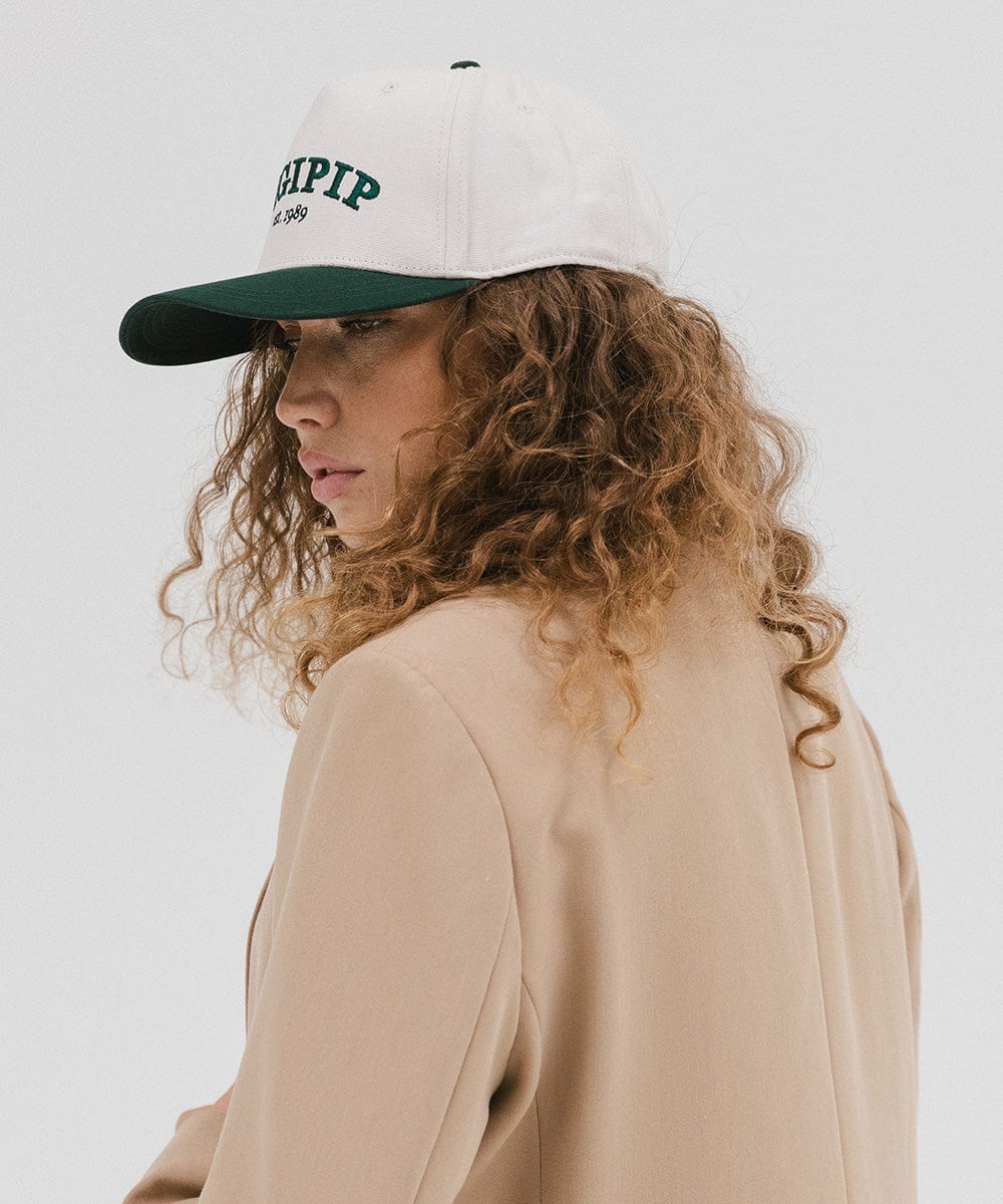 Gigi Pip trucker hats for women - Gigi Pip Canvas Trucker Hat - 100% Cotton Canvas w/ cotton sweatband + reinforced from panel with 100% polyester mesh trucker hats with gigi pip embroidered on the front panel with an adjustable velcro bag [cream-dark green]