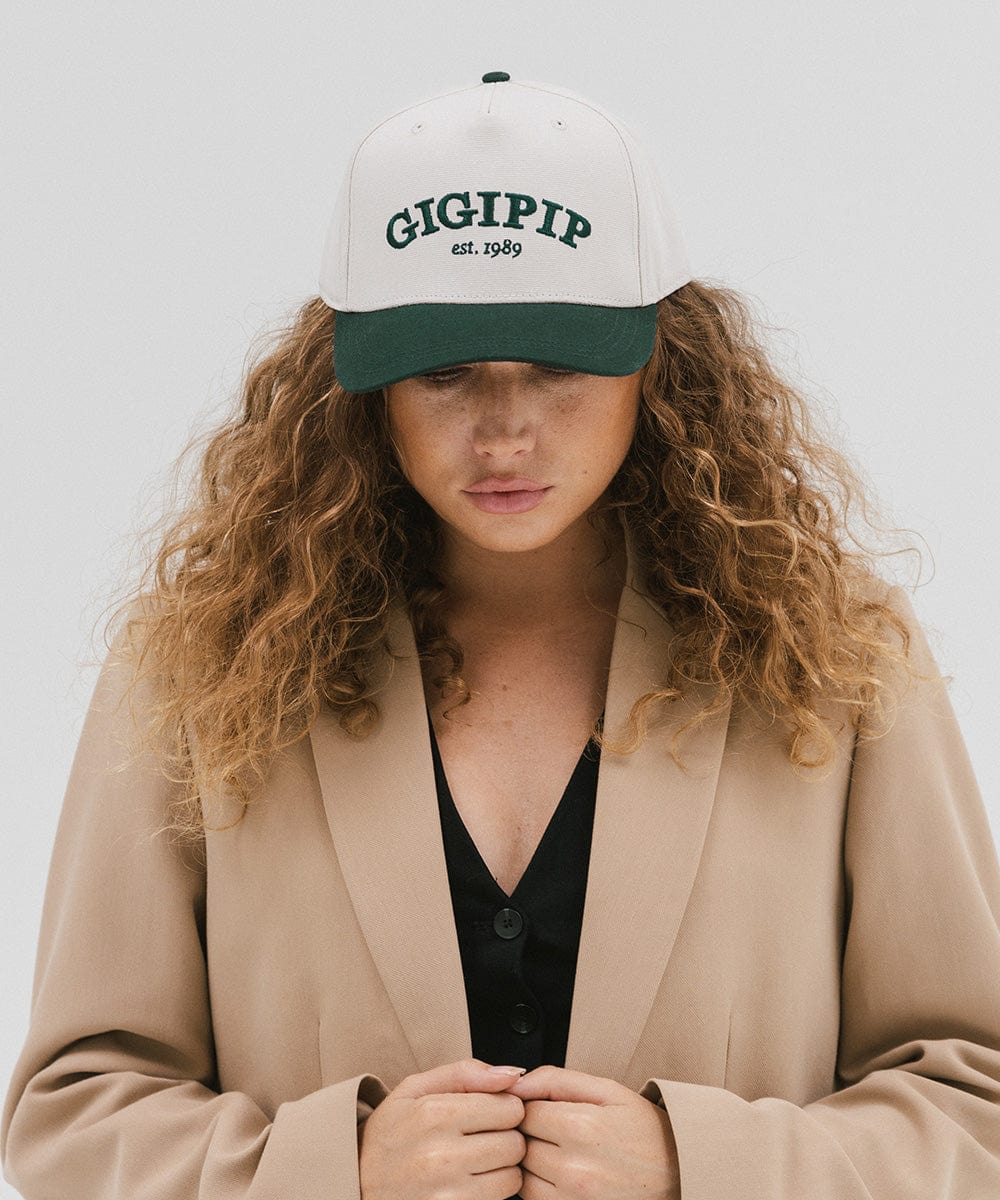 Gigi Pip trucker hats for women - Gigi Pip Canvas Trucker Hat - 100% Cotton Canvas w/ cotton sweatband + reinforced from panel with 100% polyester mesh trucker hats with gigi pip embroidered on the front panel with an adjustable velcro bag [cream-dark green]