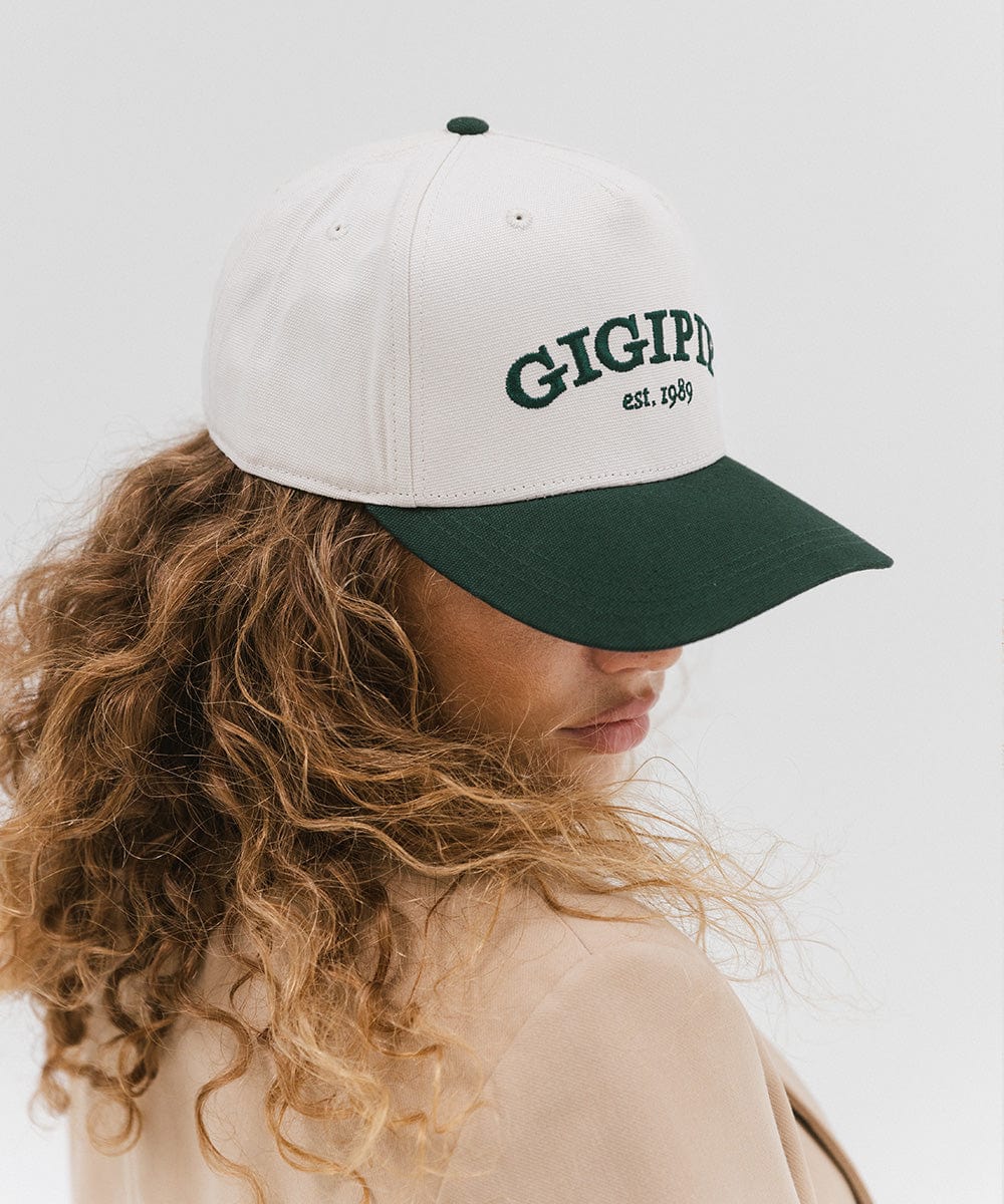 Gigi Pip trucker hats for women - Gigi Pip Canvas Trucker Hat - 100% Cotton Canvas w/ cotton sweatband + reinforced from panel with 100% polyester mesh trucker hats with gigi pip embroidered on the front panel with an adjustable velcro bag [cream-dark green]