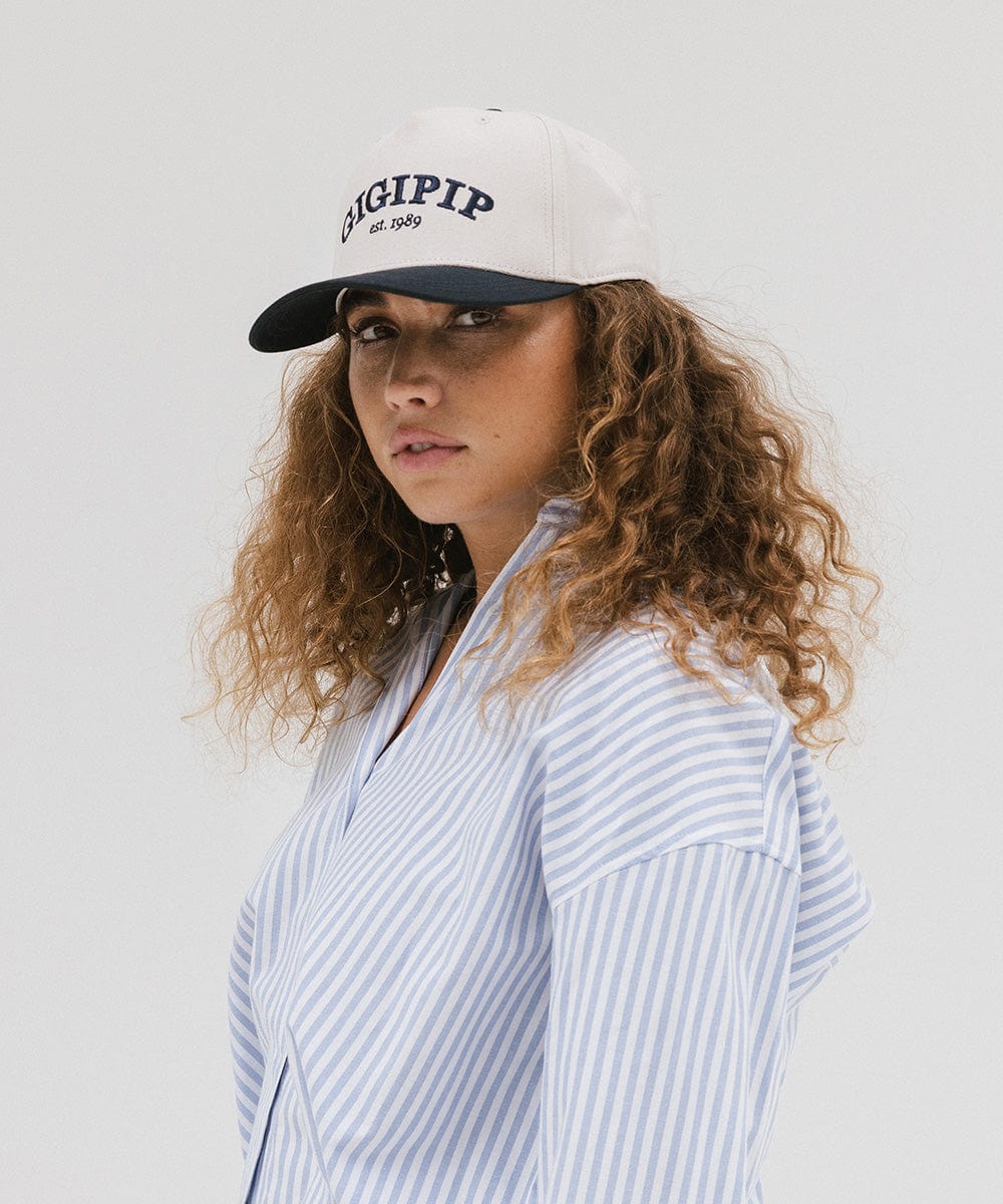 Gigi Pip trucker hats for women - Gigi Pip Canvas Trucker Hat - 100% Cotton Canvas w/ cotton sweatband + reinforced from panel with 100% polyester mesh trucker hats with gigi pip embroidered on the front panel with an adjustable velcro bag [cream-navy]