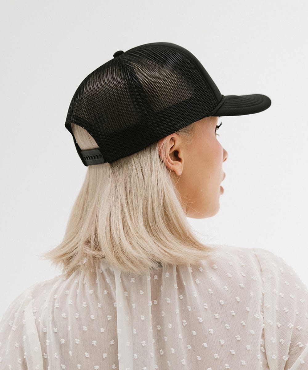 Gigi Pip trucker hats for women - Gigi Rodeo Foam Trucker Hat - 100% polyester foam + mesh trucker hat with a curved brim featuring the words "gigi rodeo" in a contrasting color as a design across the front panel [black]