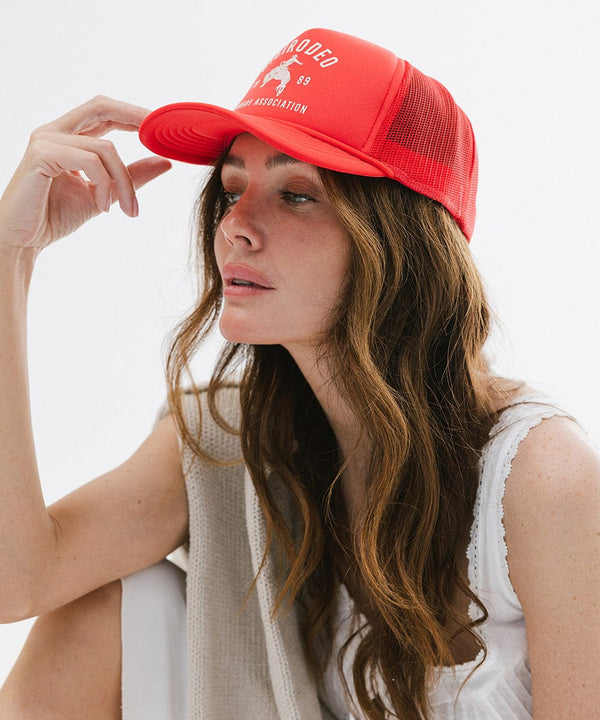 Gigi Pip trucker hats for women - Gigi Rodeo Foam Trucker Hat - 100% polyester foam + mesh trucker hat with a curved brim featuring the words "gigi rodeo" in a contrasting color as a design across the front panel [red]