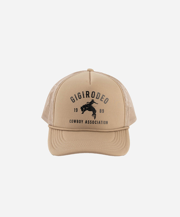 Gigi Pip trucker hats for women - Gigi Rodeo Foam Trucker Hat - 100% polyester foam + mesh trucker hat with a curved brim featuring the words "gigi rodeo" in a contrasting color as a design across the front panel [tan]