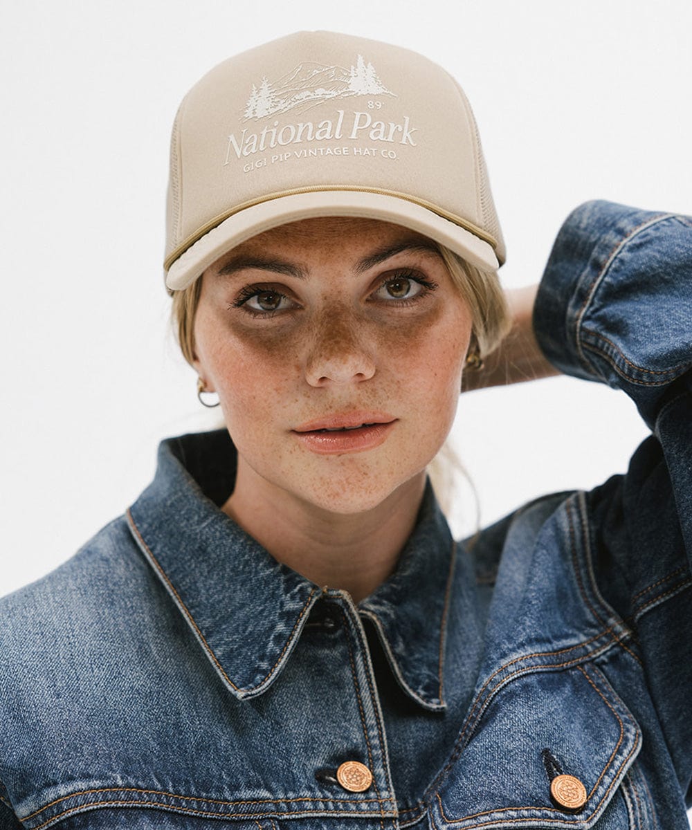 Gigi Pip trucker hats for women - National Parks Foam Trucker Hat - 100% polyester foam + mesh trucker hat with a curved brim featuring the words "National Parks" in a contrasting color as a design across the front panel [tan]