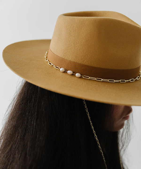 Gigi Pip felt hats for women - Raine Wide Brim Fedora - wide flat brim with a fedora crown, featuring a gold-plated removable paperclip brass chain with three faux pearls and a hand-sewn grosgrain band with the gold Gigi Pip bar around the crown, as well as a removable golden chain chinstrap [honeycomb]