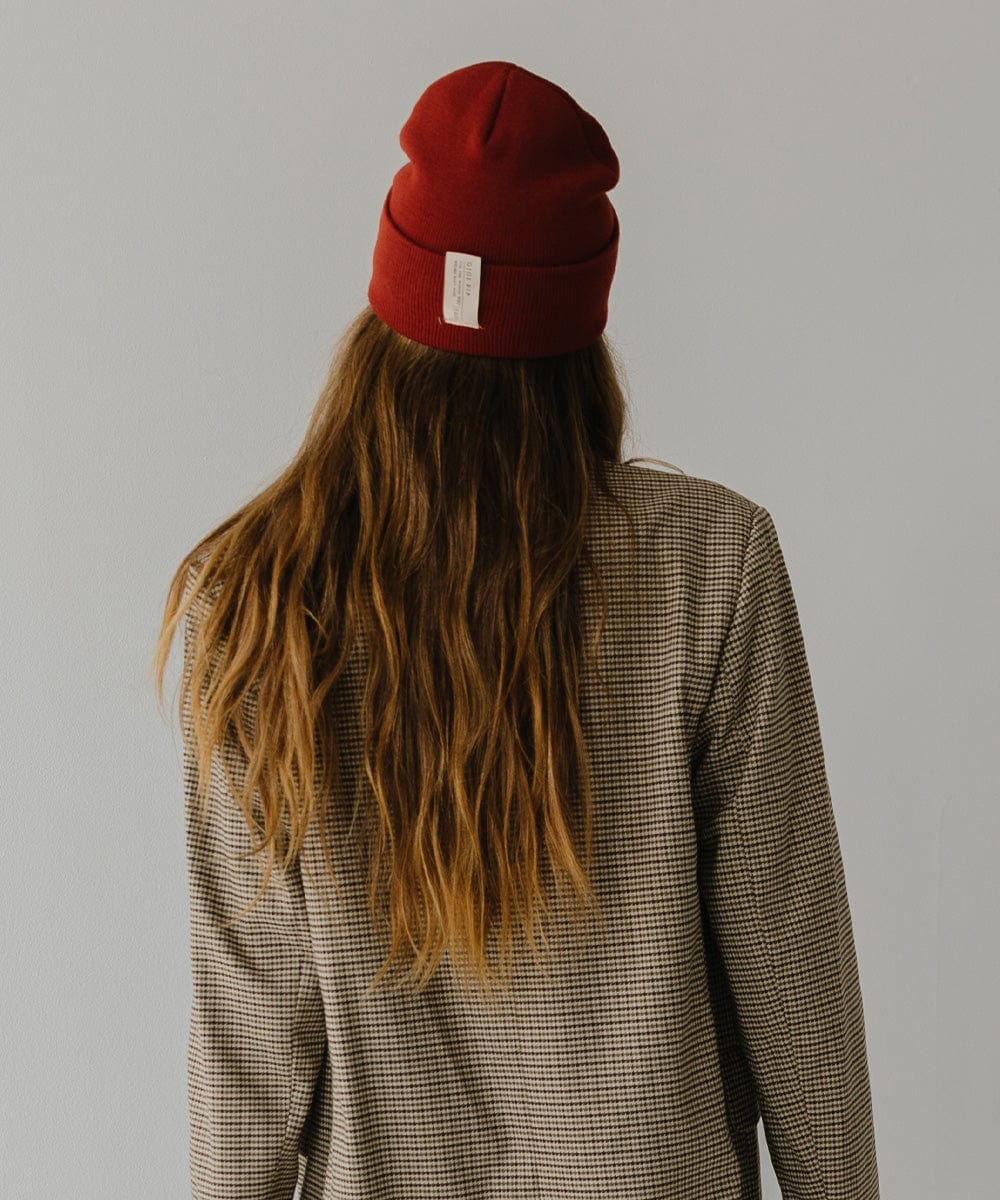 Gigi Pip beanies for women - Shay Beanie - 100% acrylic classic beanie featuring a stylized Gigi Pip loop tag on the fold that says “For the Woman Who Wears Many Hats” [brick red]