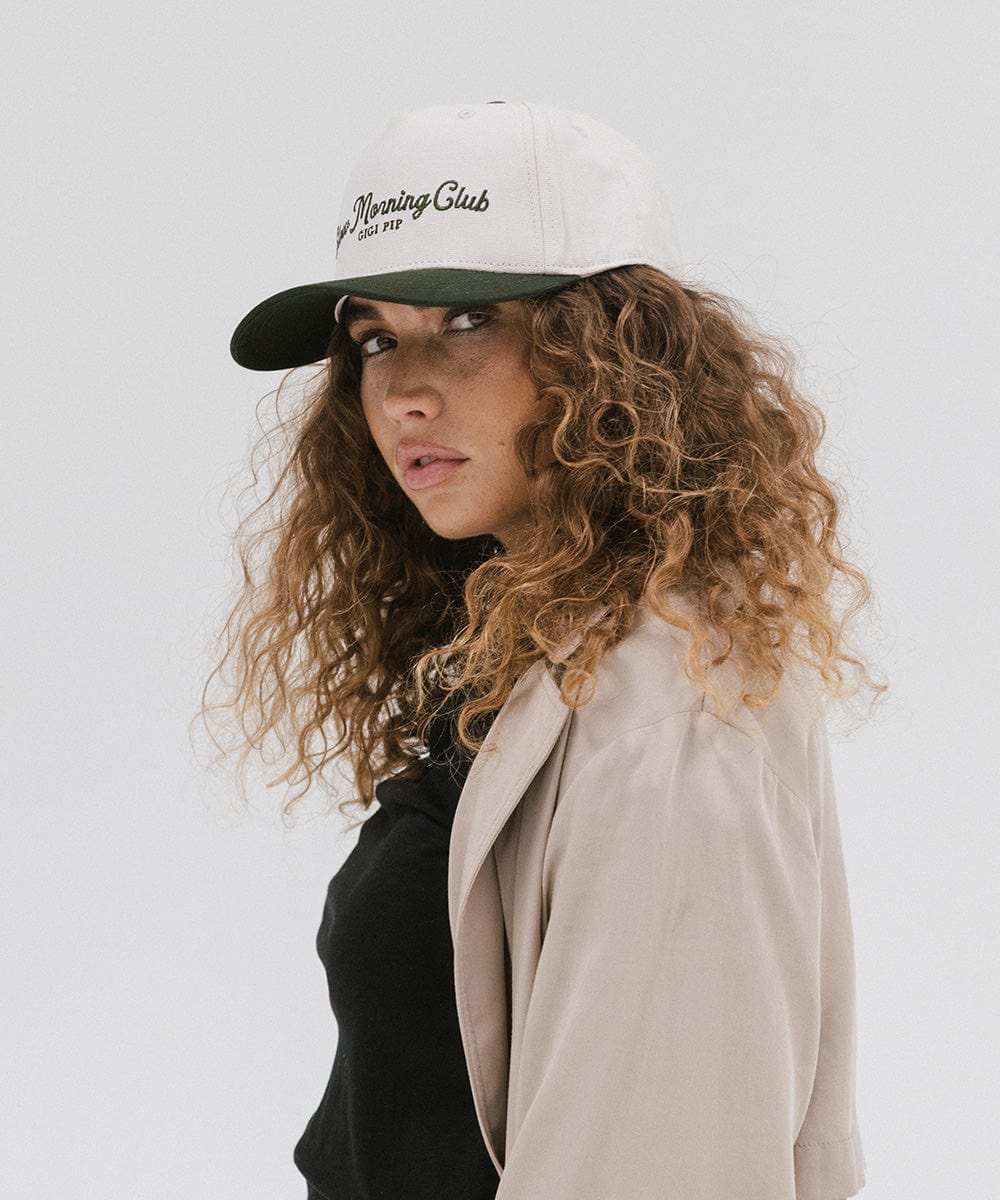 Gigi Pip trucker hats for women - Slow Morning Club Canvas Trucker Hat - 100% cotton canvas w/ cotton sweatband + reinforced from inner panel with 100% plolyester mesh trucker with Slow Morning Club embroidered on the front panel featuring an adjustable back strap [cream-dark green]