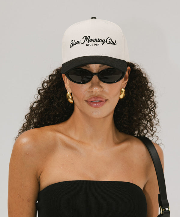 Gigi Pip trucker hats for women - Slow Morning Club Canvas Trucker Hat - 100% cotton canvas w/ cotton sweatband + reinforced from inner panel with 100% plolyester mesh trucker with Slow Morning Club embroidered on the front panel featuring an adjustable back strap [cream-black]