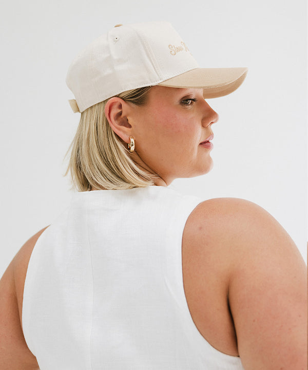 Gigi Pip trucker hats for women - Slow Morning Club Canvas Trucker Hat - 100% cotton canvas w/ cotton sweatband + reinforced from inner panel with 100% plolyester mesh trucker with Slow Morning Club embroidered on the front panel featuring an adjustable back strap [cream-tan]