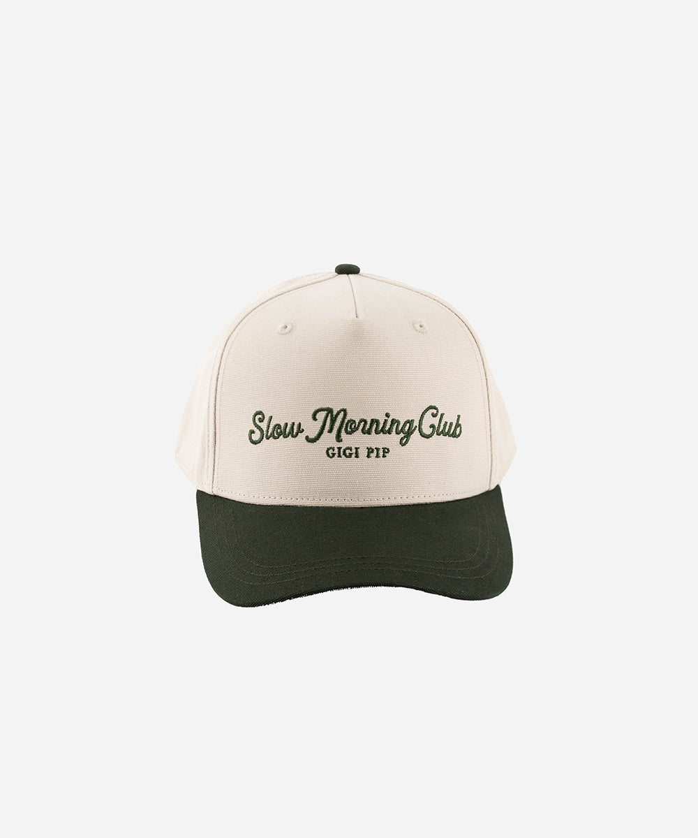 Gigi Pip trucker hats for women - Slow Morning Club Canvas Trucker Hat - 100% cotton canvas w/ cotton sweatband + reinforced from inner panel with 100% plolyester mesh trucker with Slow Morning Club embroidered on the front panel featuring an adjustable back strap [cream-dark green]