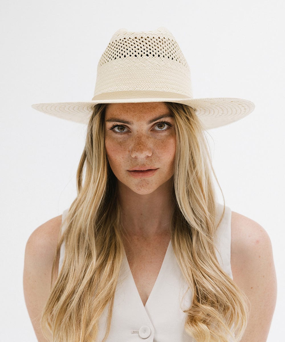 Gigi Pip western straw cowgirl hats for women - a paper straw western cattleman crown cowgirl hat with a casual semi floppy flat brim for the summer featuring a GP pin on the back [natural]