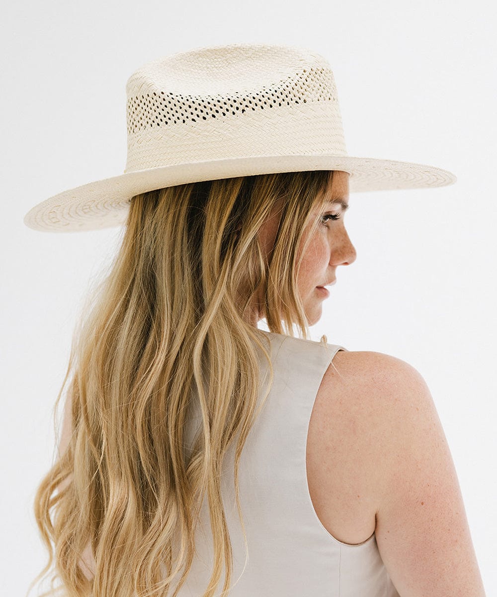 Gigi Pip western straw cowgirl hats for women - a paper straw western cattleman crown cowgirl hat with a casual semi floppy flat brim for the summer featuring a GP pin on the back [natural]