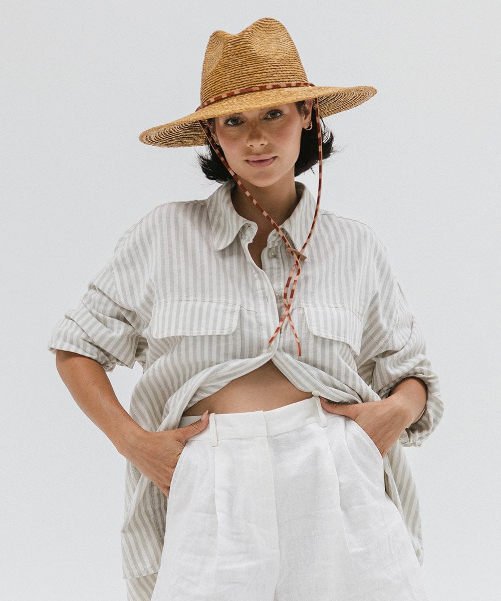 Gigi Pip straw hats for women - Ozzy Lifegaurd Hat - made of a tight weave raffia straw with a relaxed a-line brim, hand-painted leather chinstrap [honey]