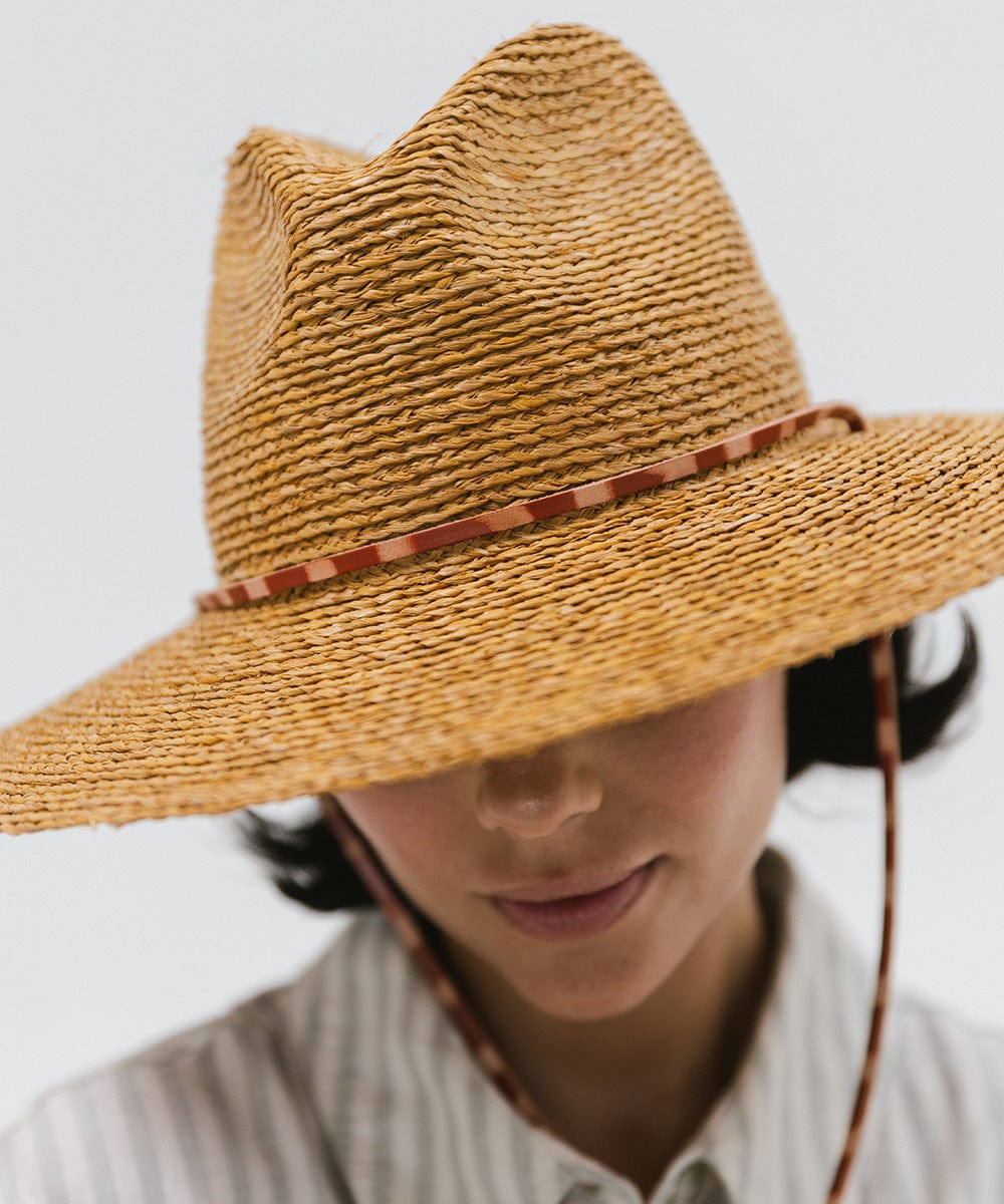 Gigi Pip straw hats for women - Ozzy Lifegaurd Hat - made of a tight weave raffia straw with a relaxed a-line brim, hand-painted leather chinstrap [honey]