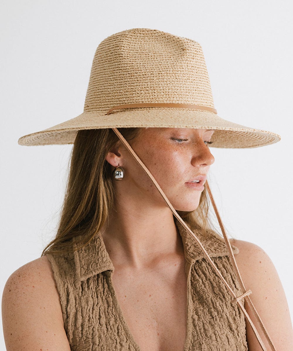 Gigi Pip straw hats for women - Ozzy Lifegaurd Hat - made of a tight weave raffia straw with a relaxed a-line brim, hand-painted leather chinstrap [natural]