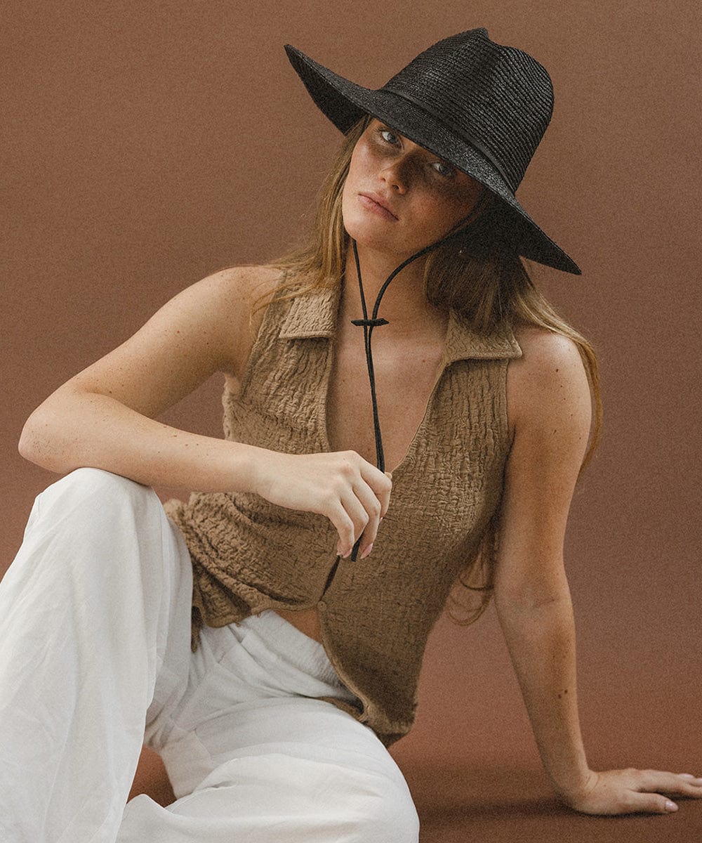 Gigi Pip straw hats for women - Ozzy Lifegaurd Hat - made of a tight weave raffia straw with a relaxed a-line brim, hand-painted leather chinstrap [black]