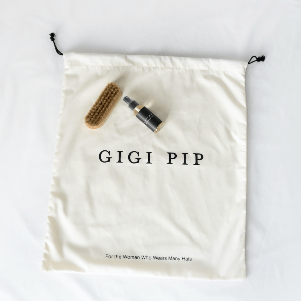 Gigi Pip hat care products - Hat Care Bundle - A curated bundle of hat care products featuring one white cotton hat keepsake bag, one handheld branded hat brush + hat stiffener spray [white]